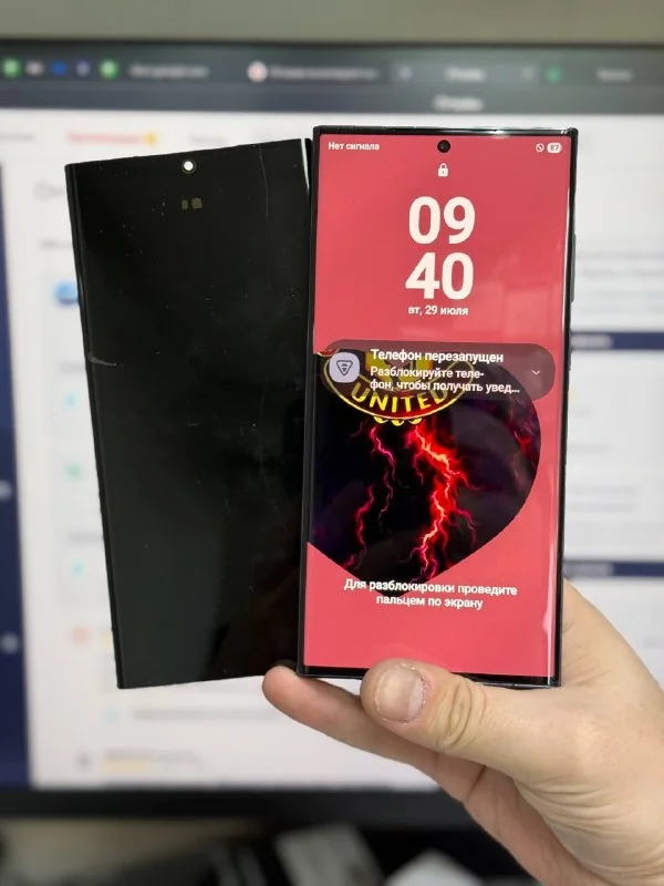 Removed display beside the phone with a working screen.